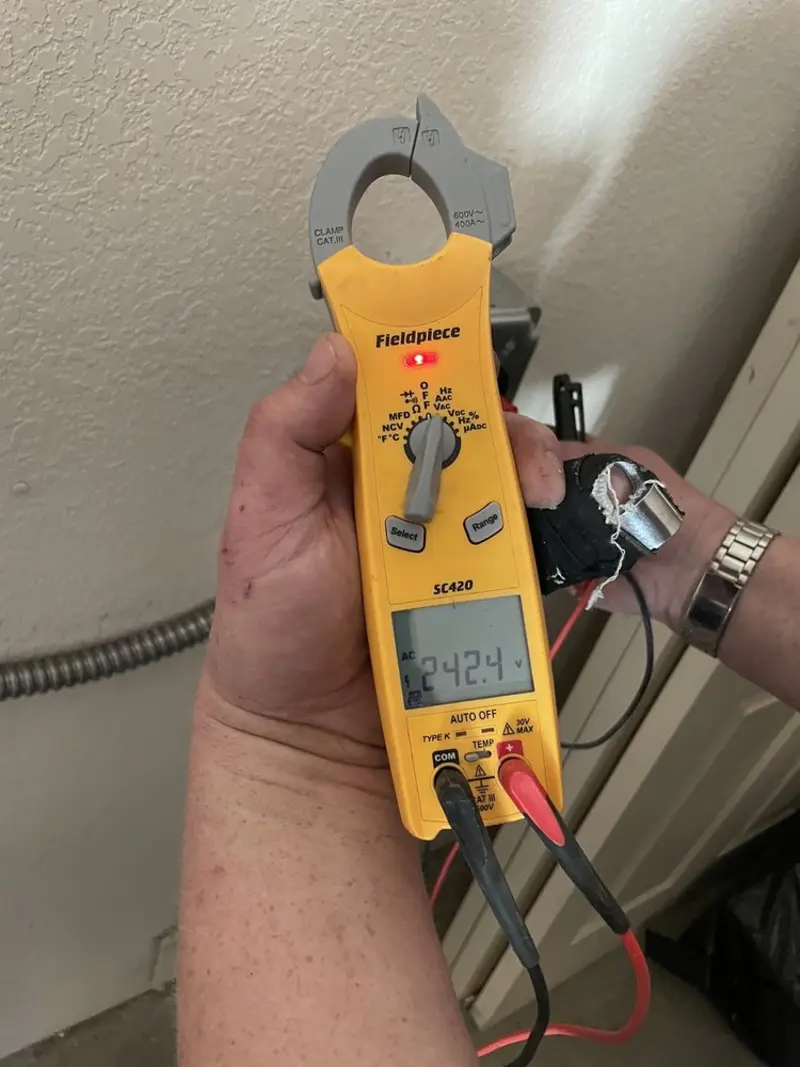 Voltage testing with clamp meter during Outlet Installation in Tega Cay